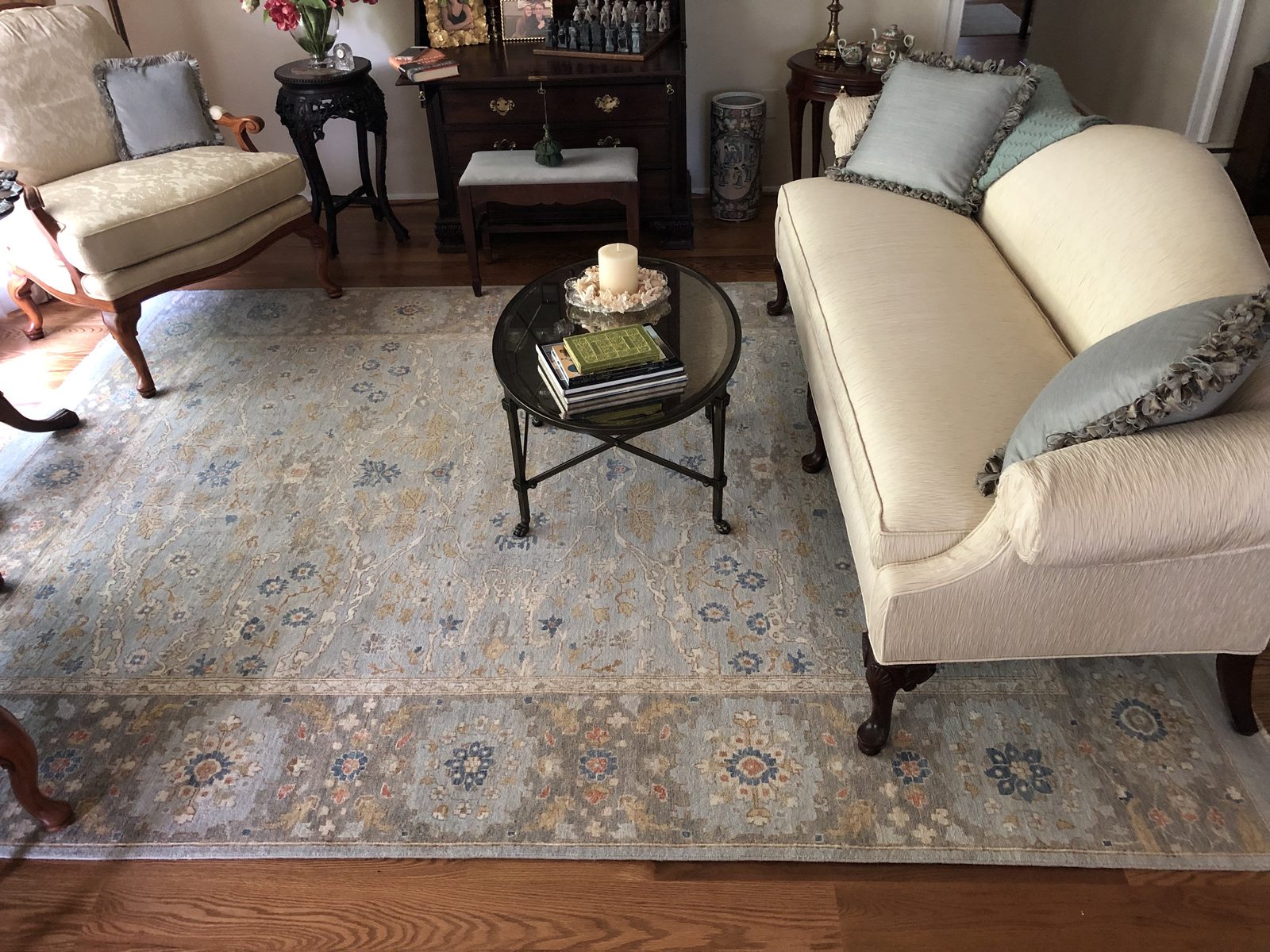 A client’s living room with a blue and grey Oushak from Senneh Knot