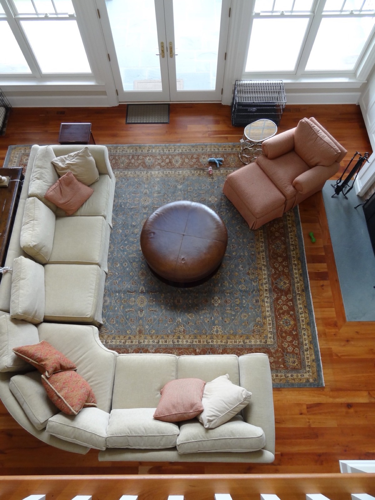 A large traditional rug in a sunlit living room, seen from above
